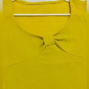A soft lemon yellow color winter short party dress. Size is medium.
